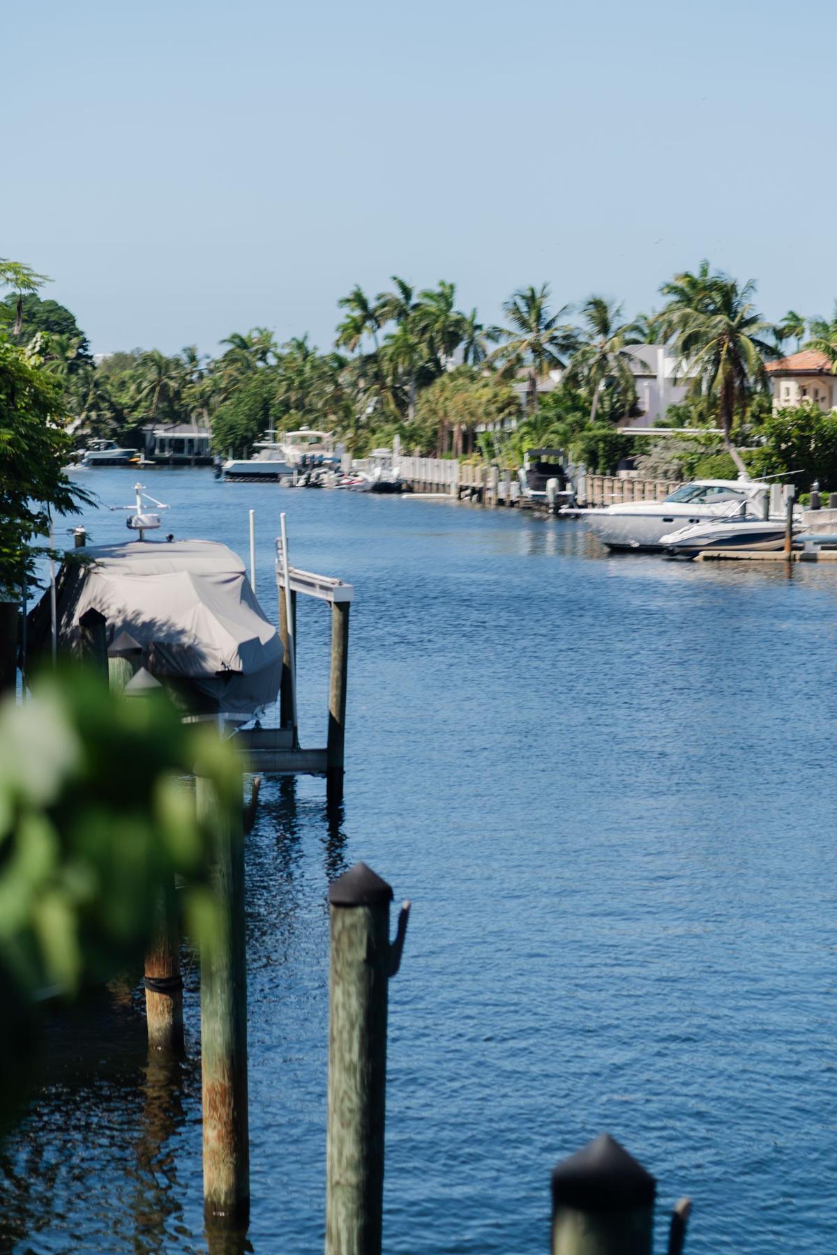 Saltwater dock showing marine growth and corrosion along a Florida canal